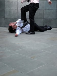 man committing battery on another man