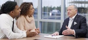 Attorney Allen L. Rothenberg speaking with clients