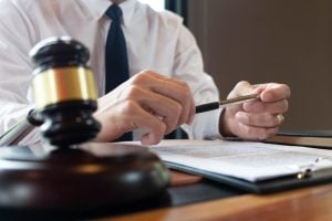 Lawyers in consultation, analyzing business and legal cases with a focus on justice and fairness.