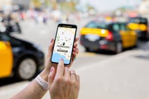 A person using ride sharing app on mobile phone.